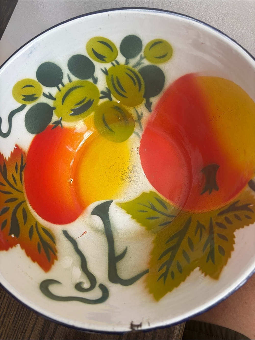 Vintage enamel bowl, white w/ fruit, orange/green/yellow, 10.5” diameter